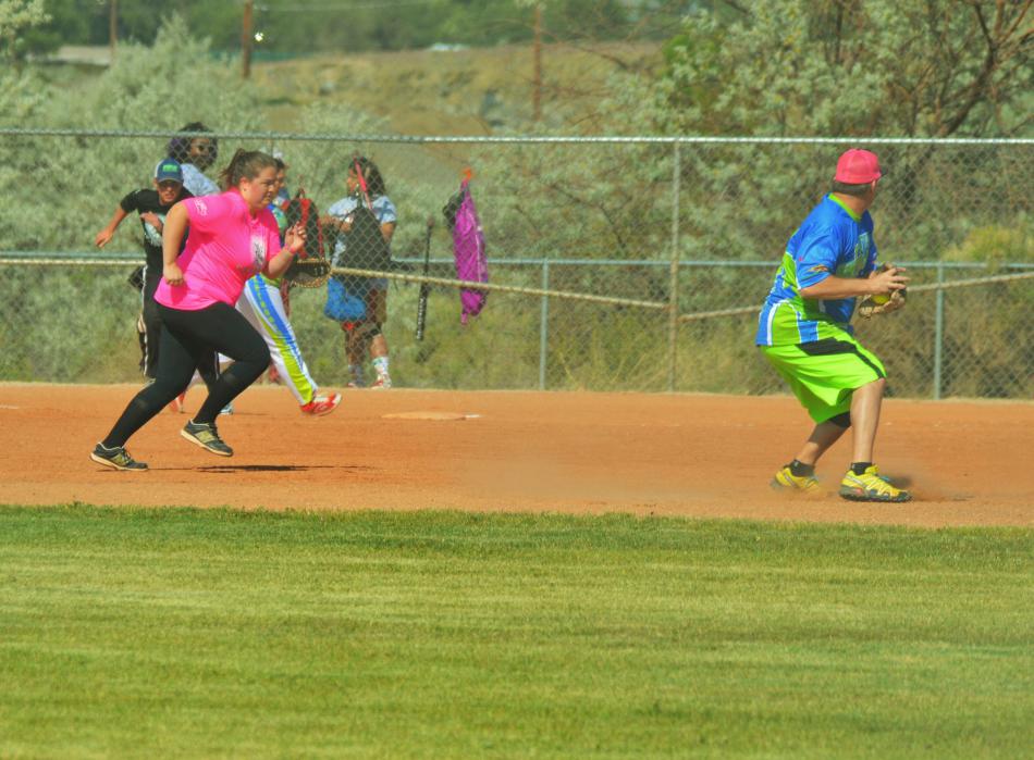 A shortstop cuts off the second base runner Saturday morning at Centennial Park.