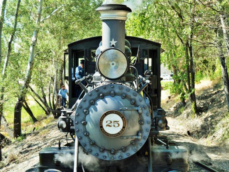 Photo by Lisa Fisher. Close up view of Engine No. 25 approaching the caboose.