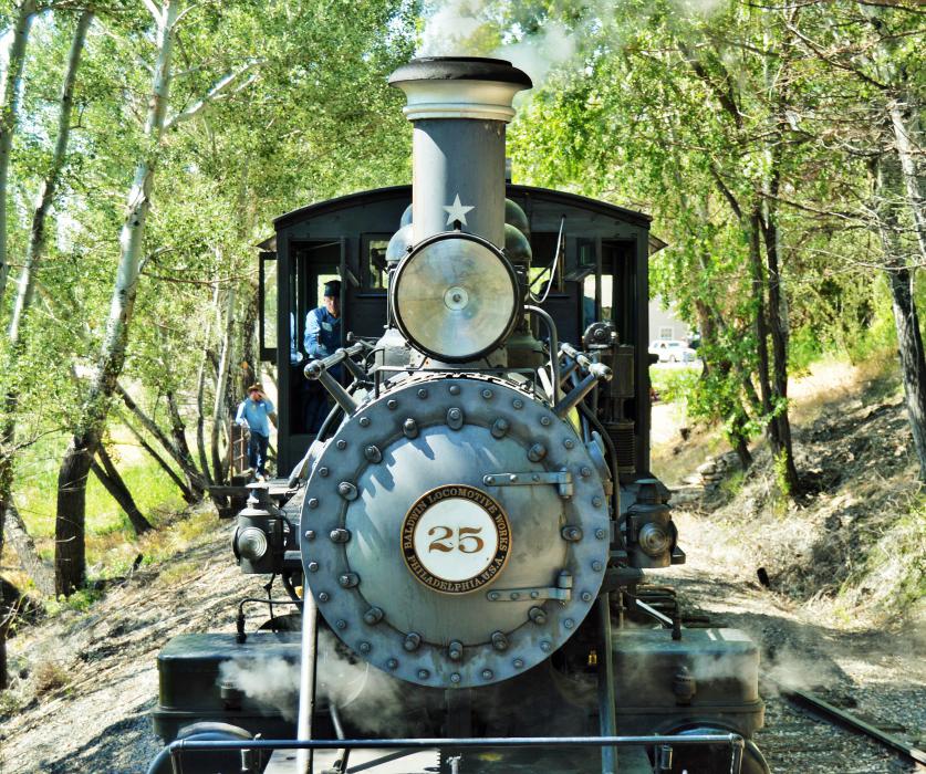 Photo by Lisa Fisher. Close up view of Engine No. 25 approaching the caboose.