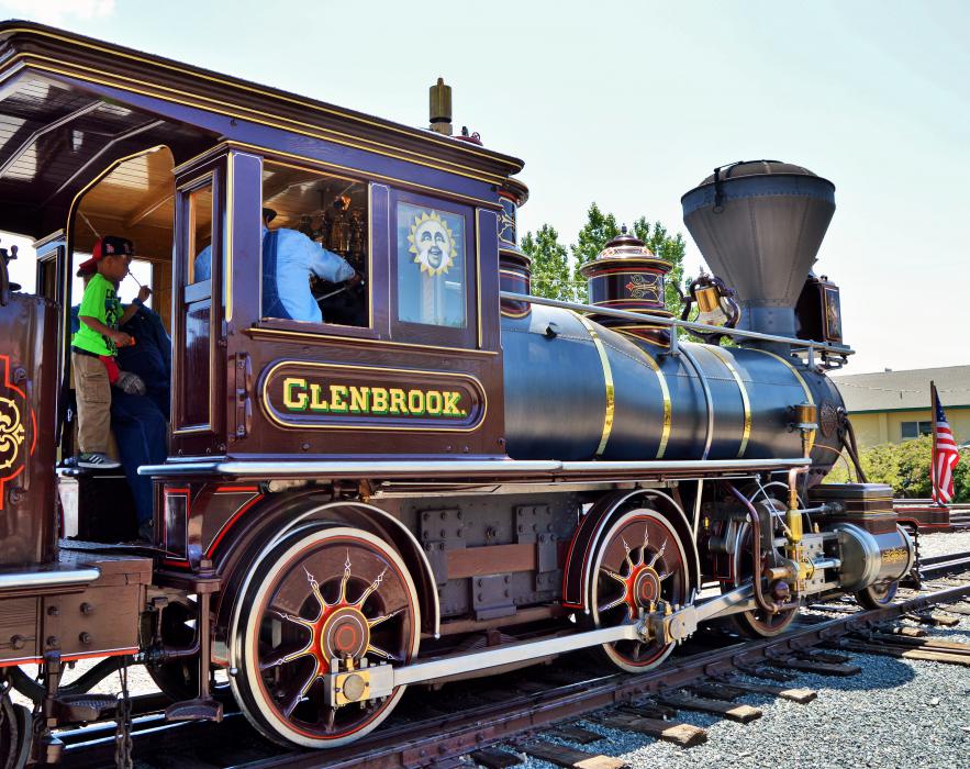 Photo by Lisa Fisher. A young passenger rings the bell aboard the Glennbrook.