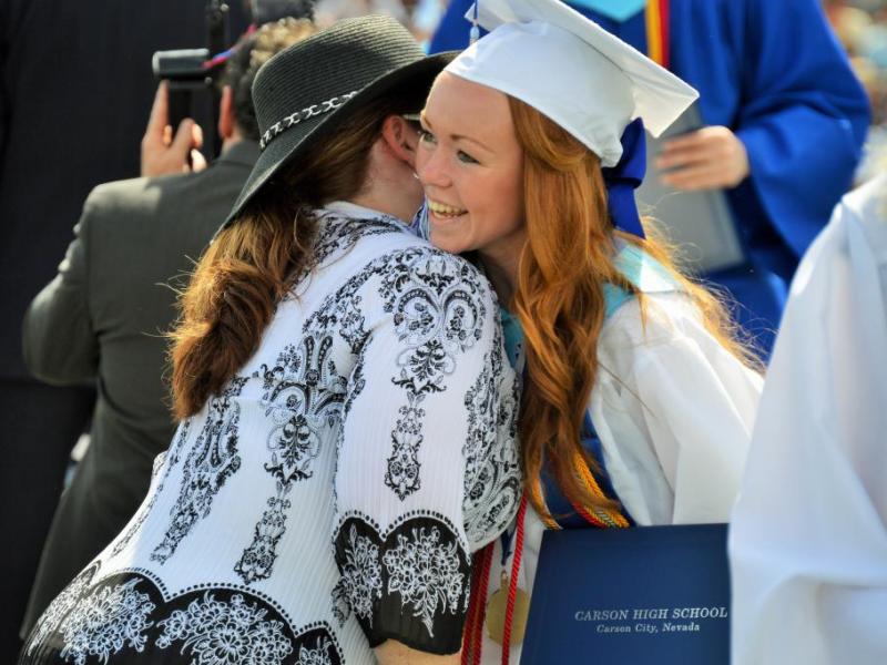 Photo by Brett Fisher. Graduates were greeted Saturday by CHS principal Tasha Fuson as they received their diplomas.