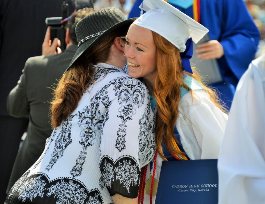 Photo by Brett Fisher. Graduates were greeted Saturday by CHS principal Tasha Fuson as they received their diplomas.