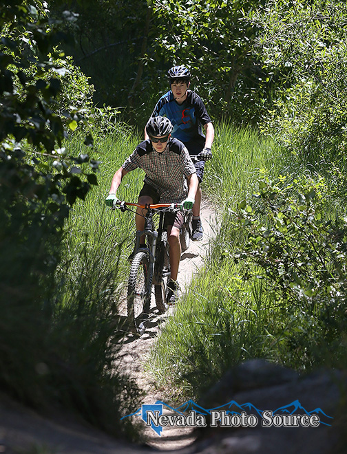 Connor and Tobin McRae ride the Ash to Kings Canyon Trail near Carson City. Cathleen Allison, Nevada Photo Source