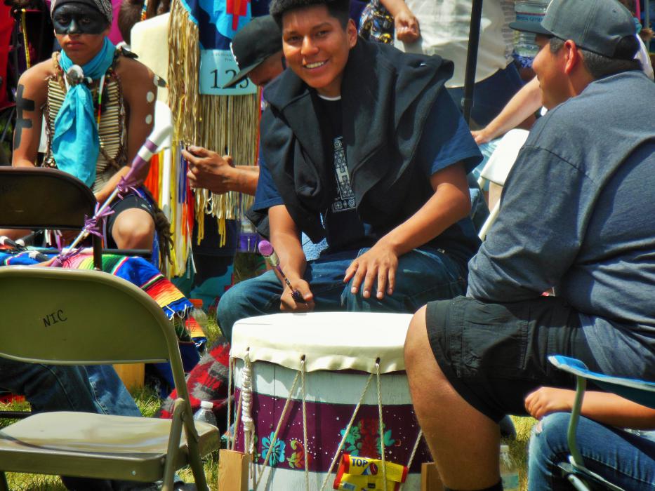 Photo by Brett Fisher. A drummer smiles during children's dance competition.