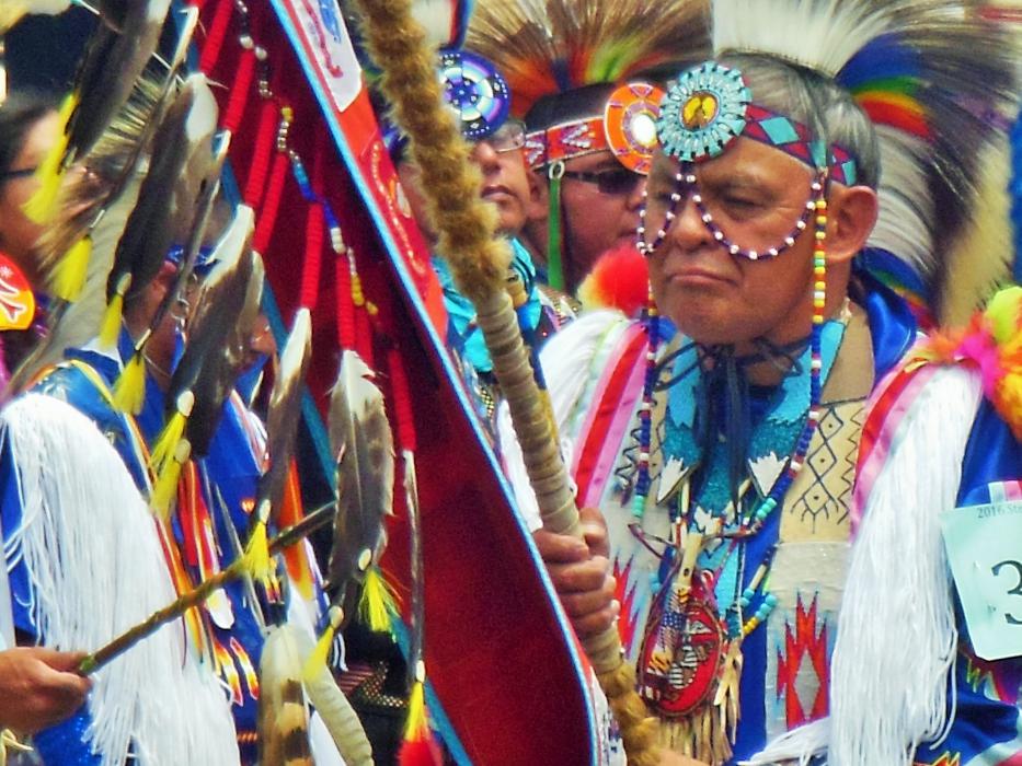 Photo by Brett Fisher. The prayer staff held during the invocation.