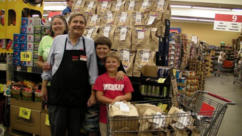 In the photo are store owners Lynne and Dave Cox and their grandkids Nicholas and Travis Heald.