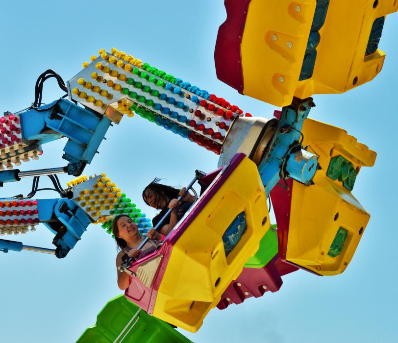 Riders spin around on a wild thrill ride.