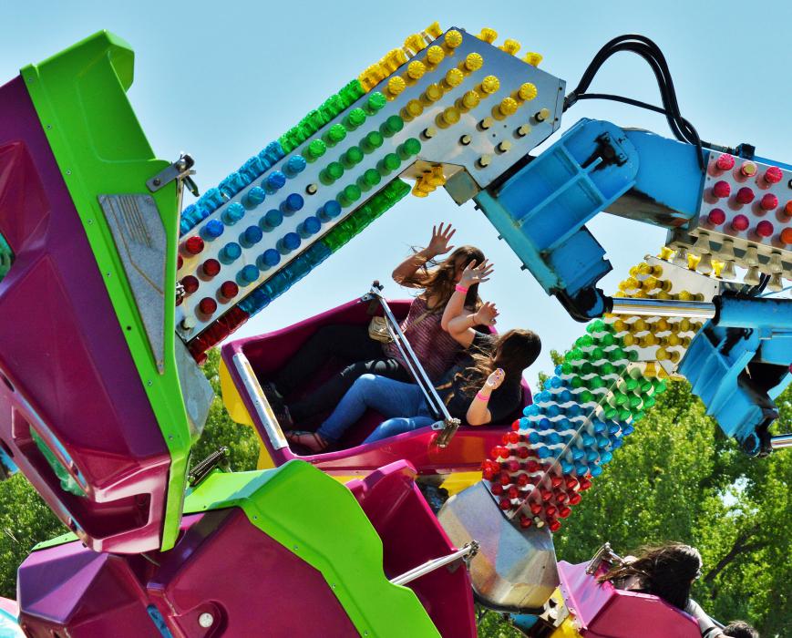 Riders express a little fear on a thrill ride.