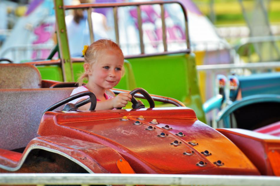A young girl on a joy ride Saturday at the carnival.