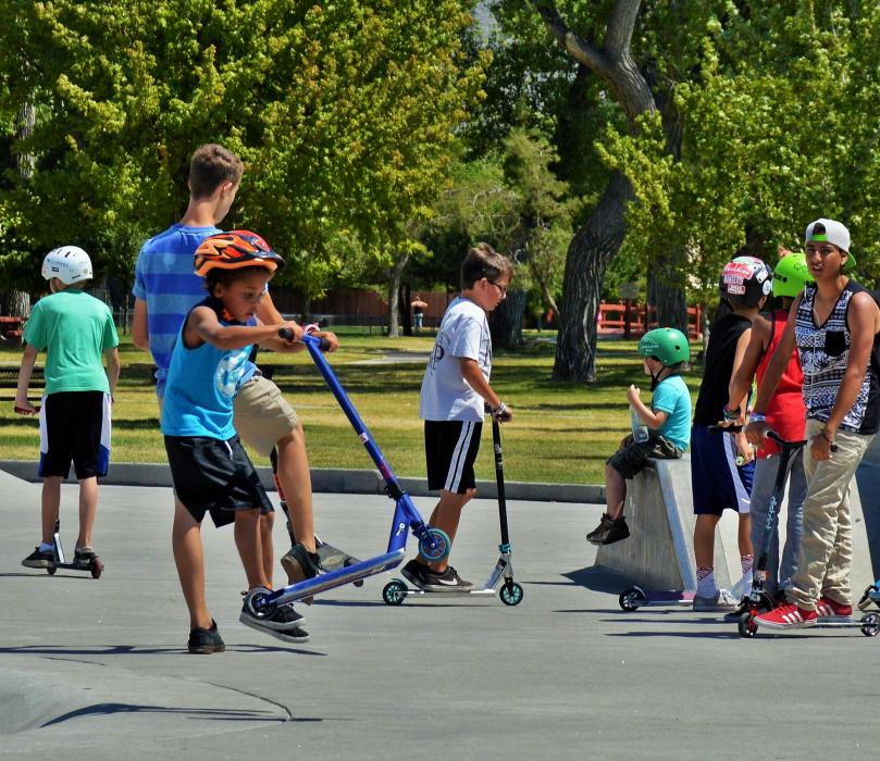 A young trick rider on his scooter during the Wheel House skate expo.
