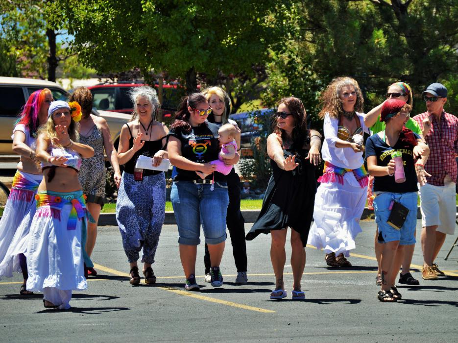 Photo by Brett Fisher. Guests participate in a belly dancing demo.