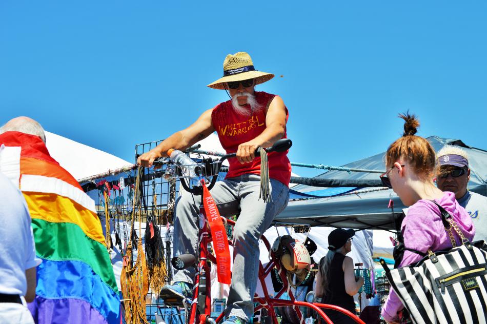 Photo by Brett Fisher. Man on a tall custom tricycle at Sassabration.