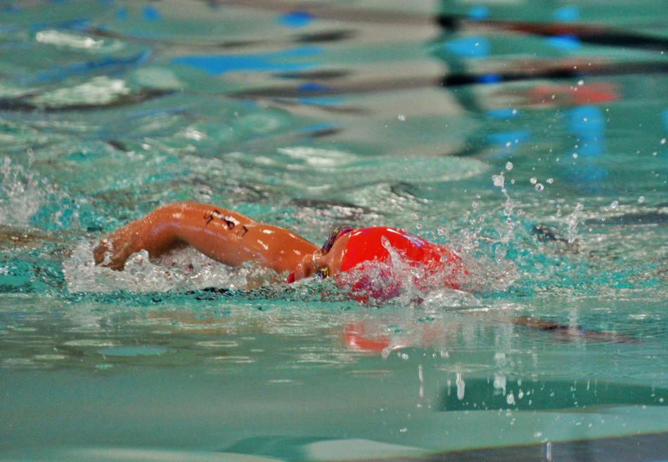 Photo by Brett Fisher. The leader of the 7-8 age group completing her lap in the pool.