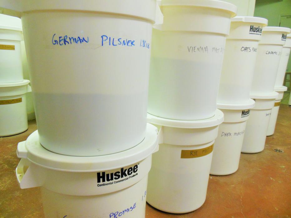 Large tubs of grains in the supply room.