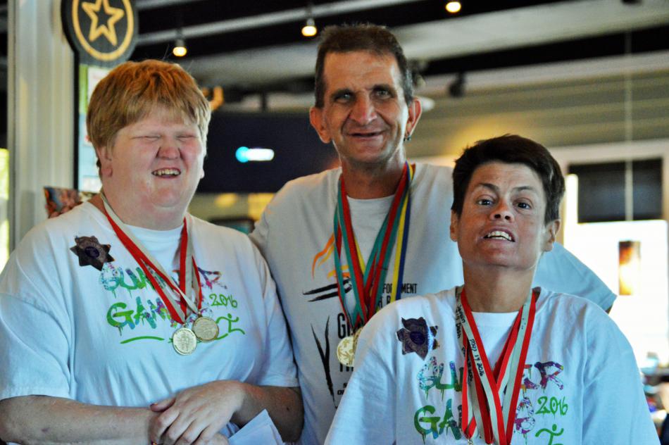 Photo by Brett Fisher. Left to right: Special Olympians Heather Hopps, Tyrone Schultz and Ramona Allen of Carson City.