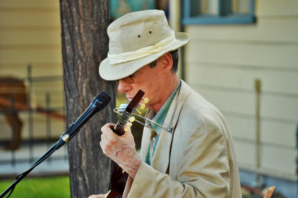Photo by Brett Fisher. Chris Bayer performs on guitar at Telegraph Square.