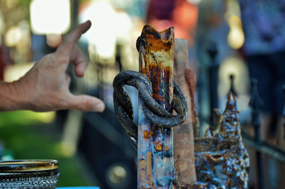 Photo by Brett Fisher. Rich McGregor talks about one of his sculptures.