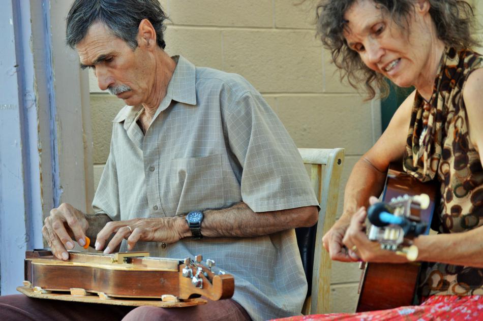 Photo by Brett Fisher. Musicians performing in front of the alley on W. Telegraph.