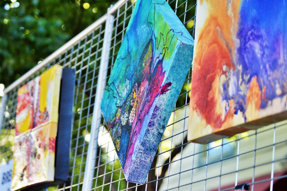 Photo by Brett Fisher. Painted canvases displayed at Telegraph Square.