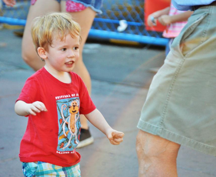 A boy dances with his grandfather Saturday in Telegraph Square.