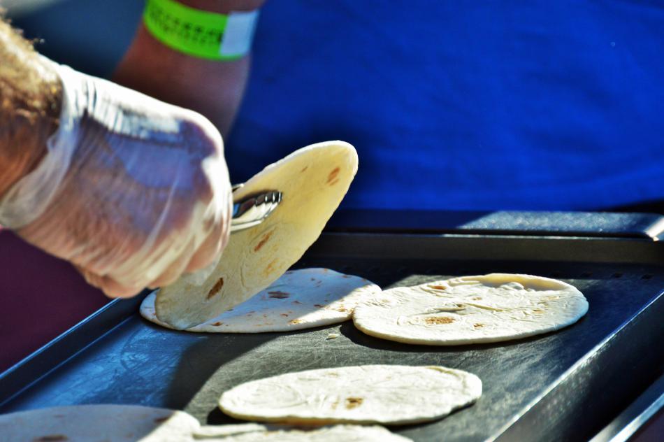 Tortillas being cooked to make tacos.