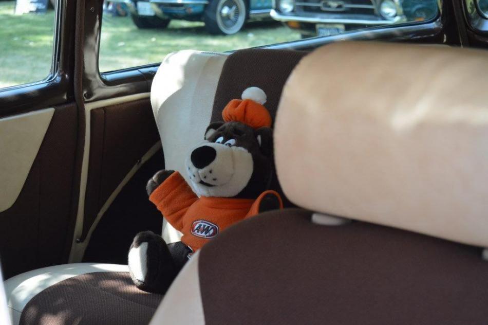 The A&W Root Beer bear in the back seat of a 1956 Chevrolet Nomad.
