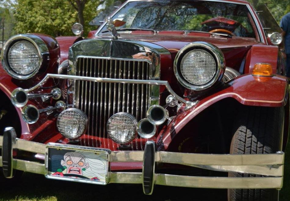 Disney's Cruella DeVille graces the license plate cover of this classic automobile much like the one she drives.