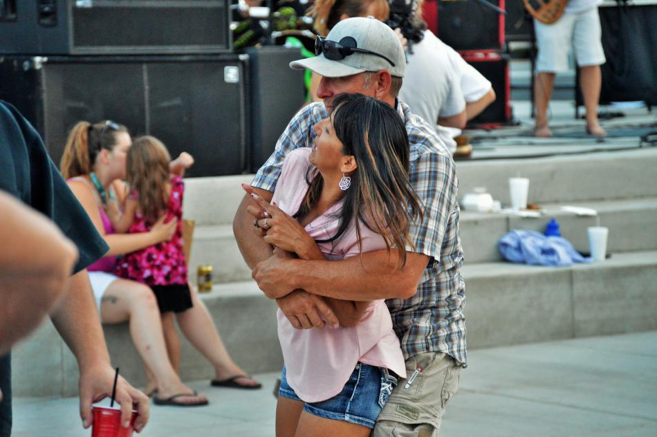 A couple dances close to the live music at Bob McFadden Plaza.