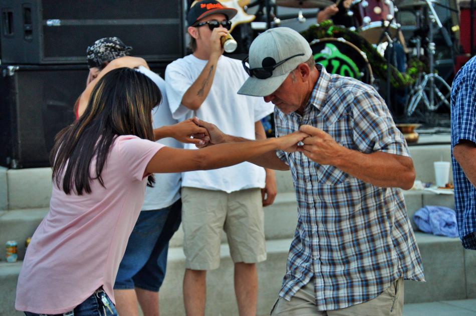 A couple grooves to live music on Bob McFadden Plaza Saturday night.