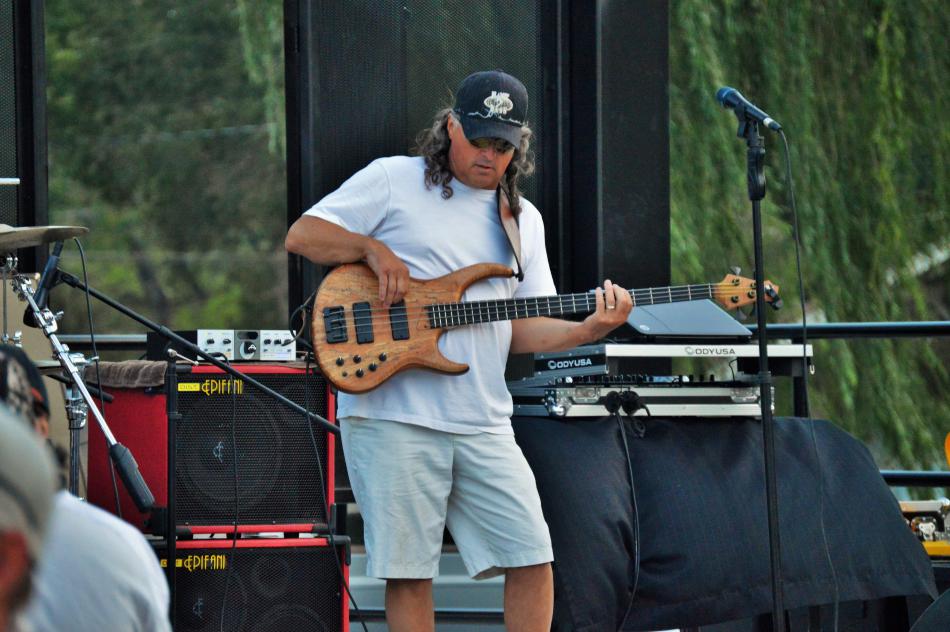 A guitarist plays a number for the crowd.