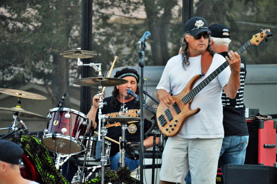 Guitarist and drummer on the stage at the Bob McFadden Plaza.