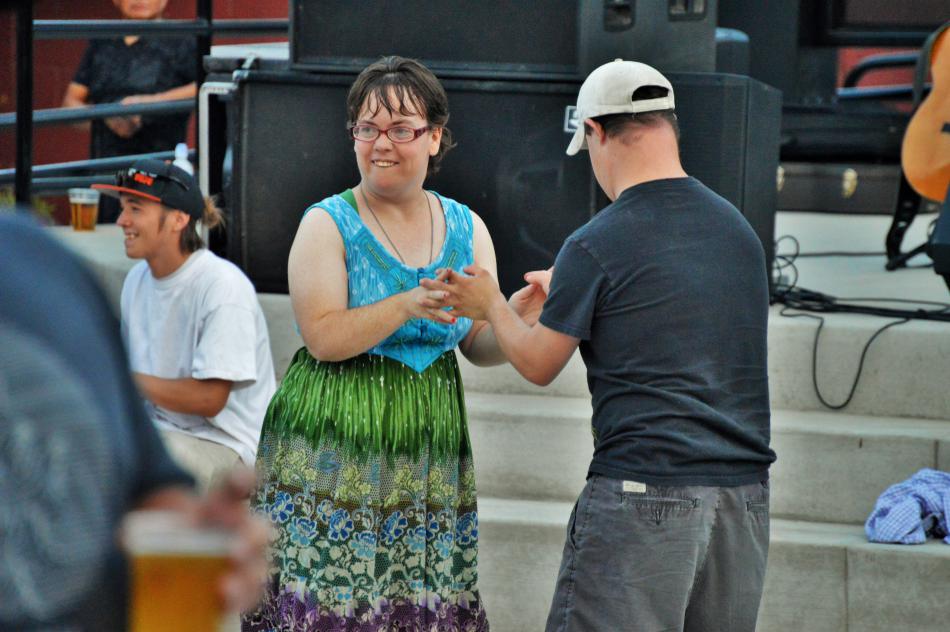 A young couple dancing to live music Saturday night on the plaza.