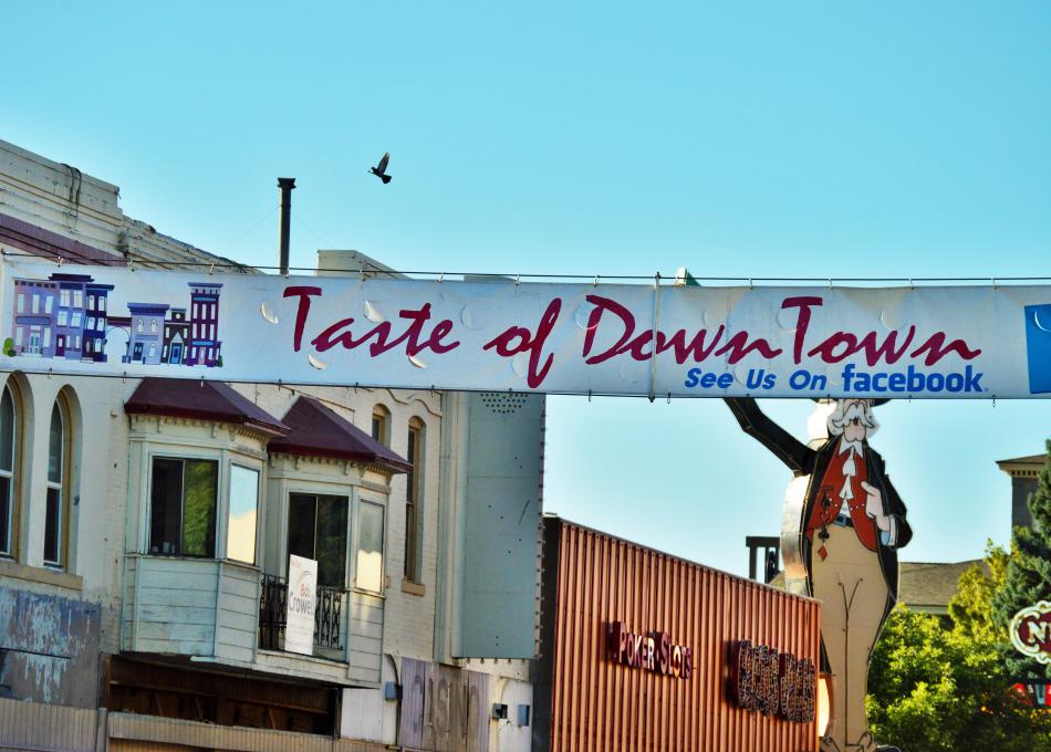 Photo by Brett Fisher. The 2016 Taste of Downtown banner stretched across Carson Street.