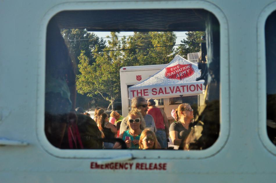 A line of visitors wait to view the interior of a WCSO chopper.