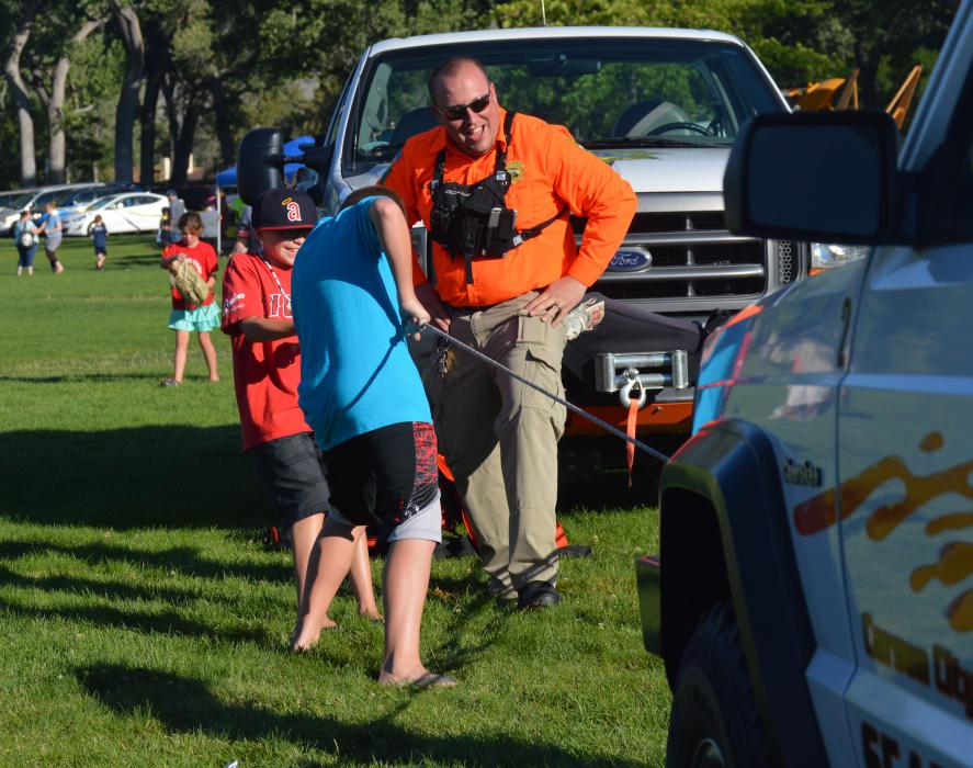 Youths attempt to pull a CCSO SAR Jeep.