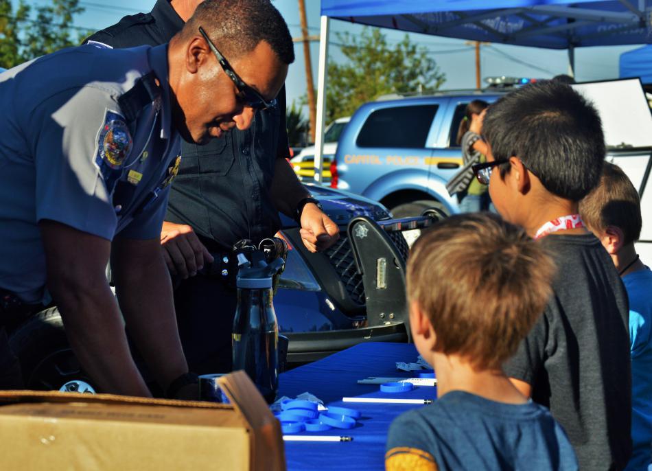 An NHP officer instructs some boys.