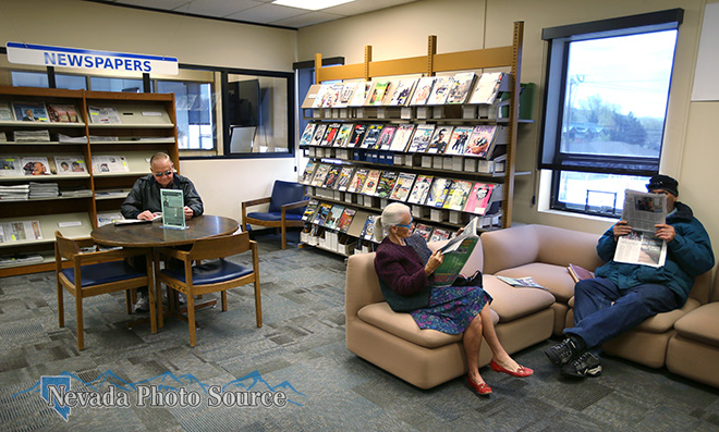 Patrons read newspapers and magazines at the Carson City Library in April 2015. Cathleen Allison, Nevada Photo Source.