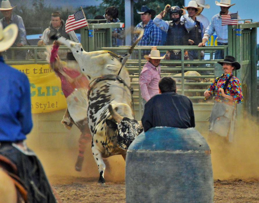 Photo by Lisa Fisher. A near miss as a bull kicks toward a bullfighter.