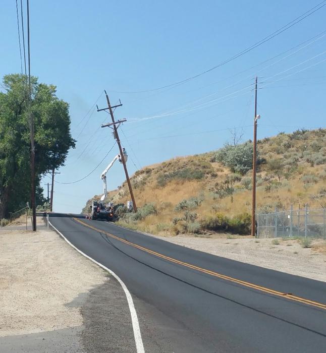 NV Energy works on a power pole along Curry Street. Photo by Paula Peterson.