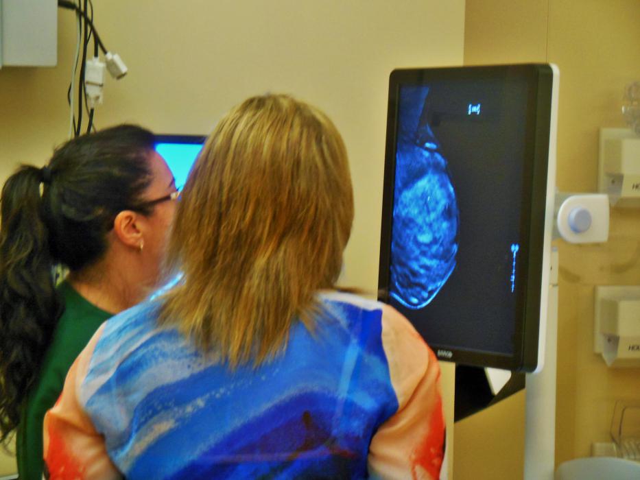A nurse shows a guest the image of a breast Thursday at the CTBC open house.