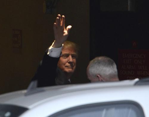 GOP presidential candidate Donald Trump waves to a group waiting for him at Harrah's. Photo by Robert Petersen
