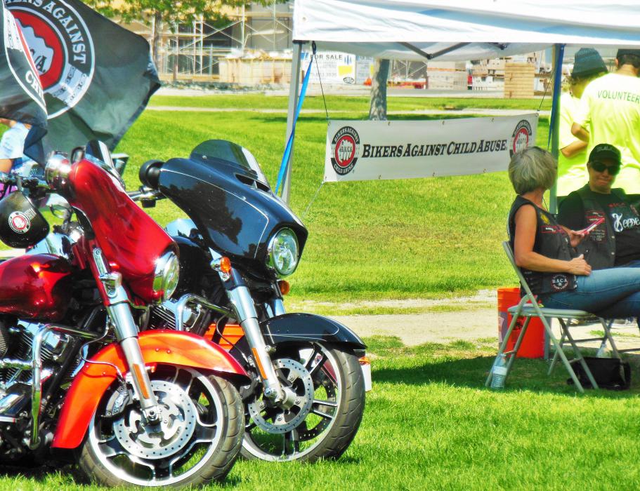 Bikers Against Child Abuse with their bikes in the foreground.