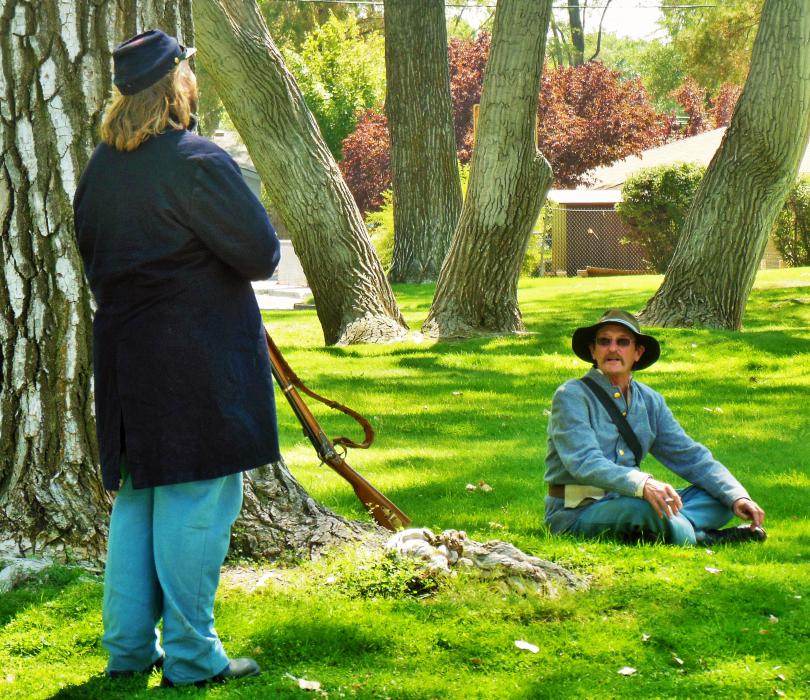 Billy Yank and Johnny Reb under a shade tree Saturday at Mills Park.