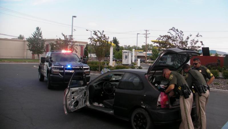 Carson City Sheriff's officers at the car recovered Monday after a citizen saw it reported stolen on Facebook.