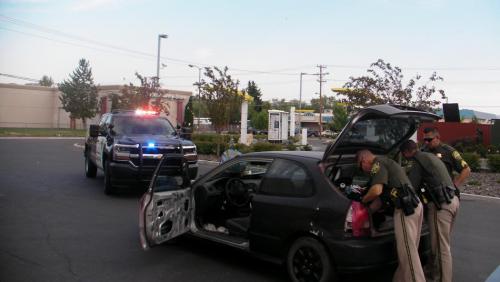 Carson City Sheriff's officers at the car recovered Monday after a citizen saw it reported stolen on Facebook.