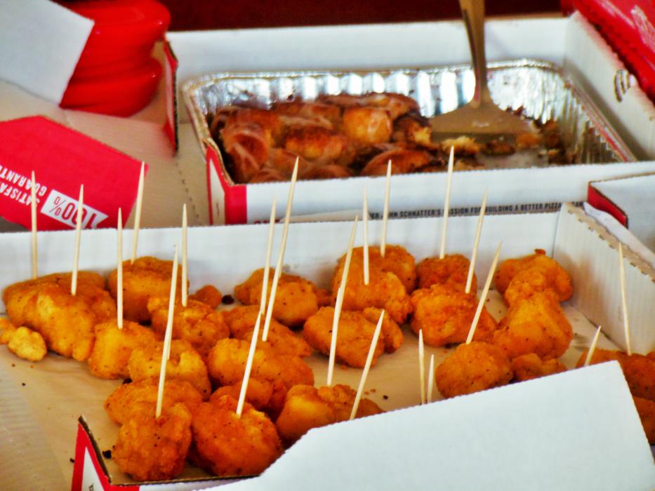 Breaded chicken bites and cinnamon rolls for guests at Wednesday's grand opening.