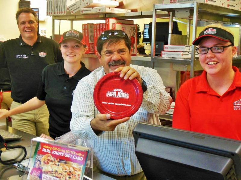Photos by Brett Fisher. Crew at the front counter of Papa John's Pizza Wednesday afternoon.