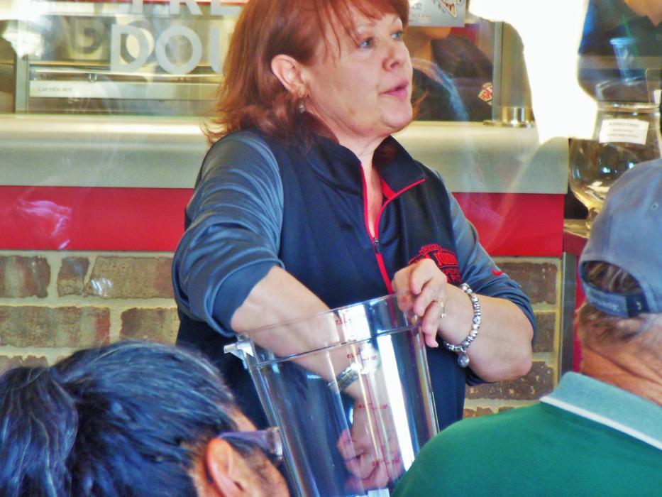 Franchise owner Susan Kubrich reaches for a raffle ticket Wednesday.