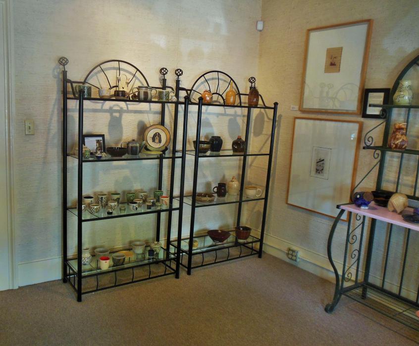 The front room gallery featuring functional pottery art by Robin McGregor.