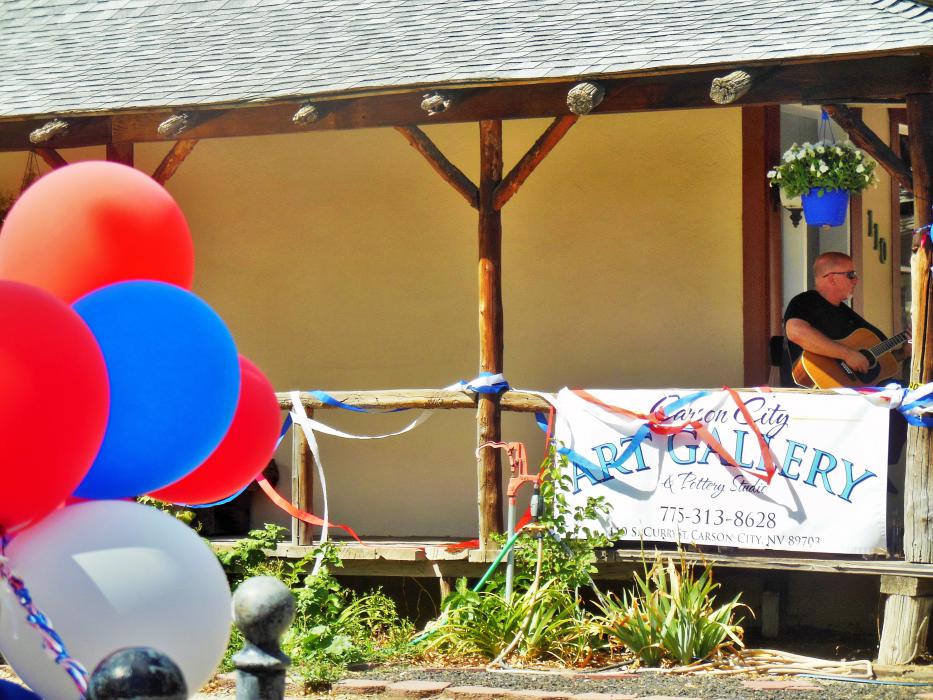 Grand opening banner and balloons at 110 S. Curry Street.